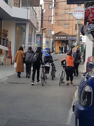English instructors riding in a bicycle group are 